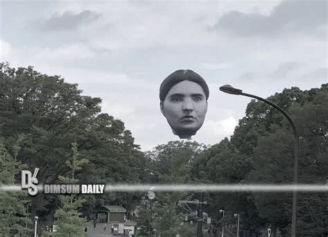 metal cover of giant floating head above house|giant floating head tokyo.